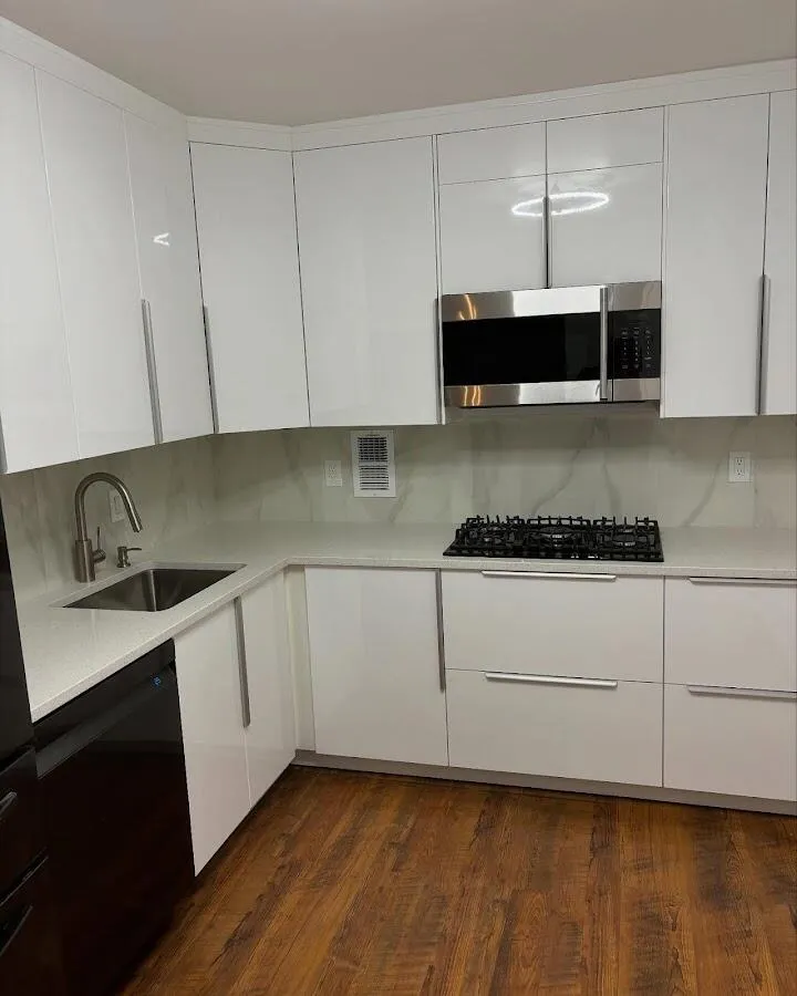 Restored kitchen with white cabinets after water damage in Bogota